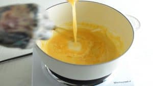 mixing broth in a pan with flour and butter