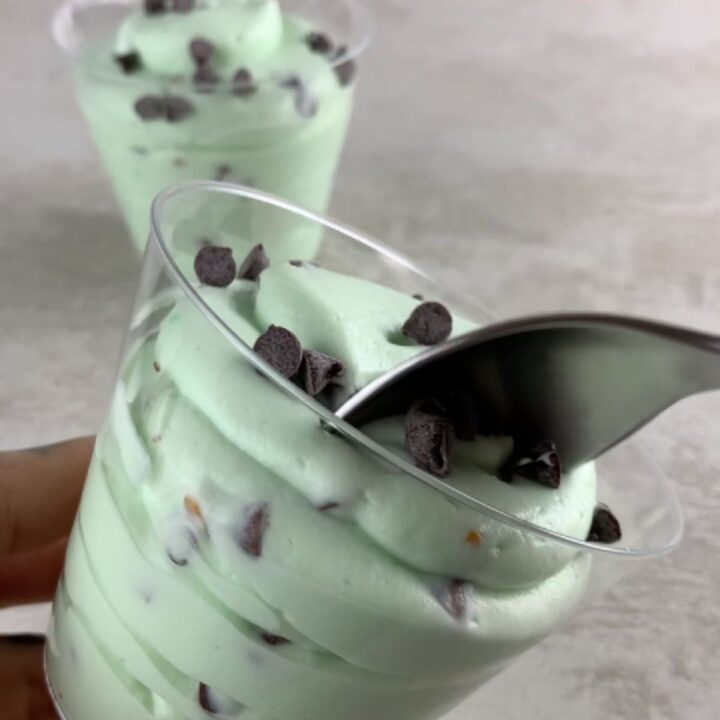 high-protein fluffy yogurt with pistachios and chocolate chips in a bowl